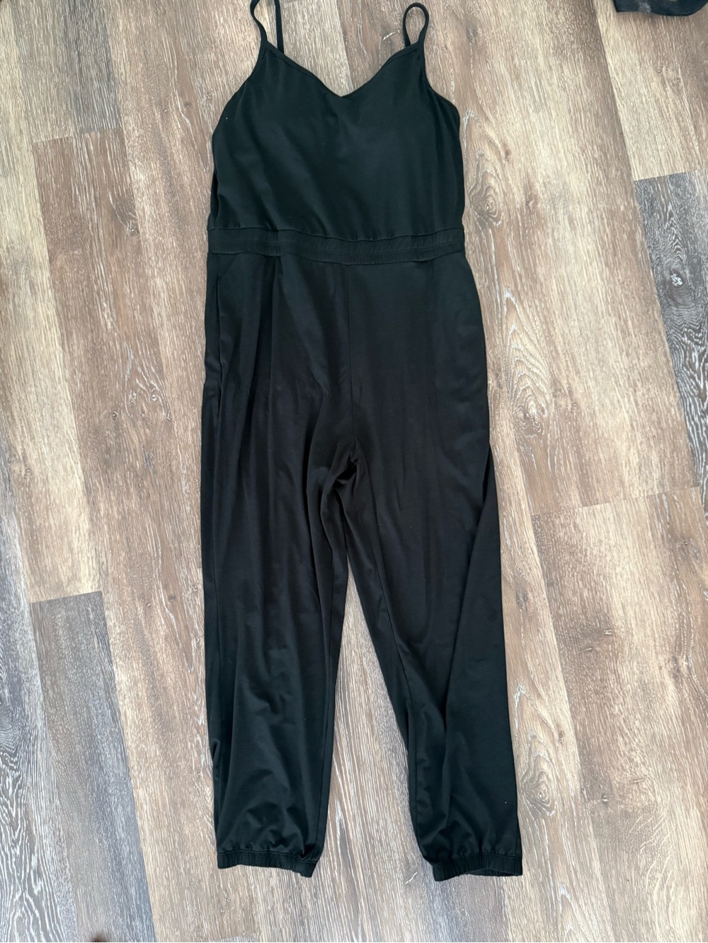 Vuori Black Sleeveless Romper with Elastic Ankles
